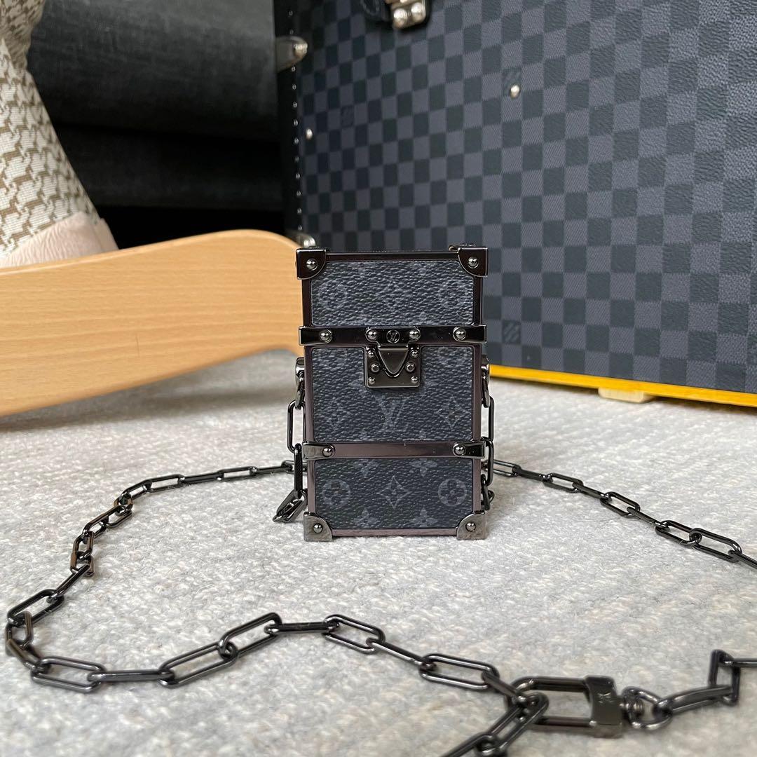 Lv Vertical trunk Pochette, Luxury, Bags & Wallets on Carousell