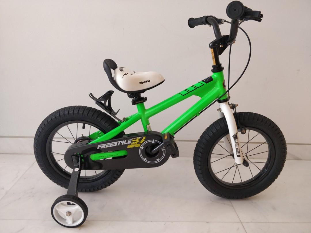 green bike with training wheels