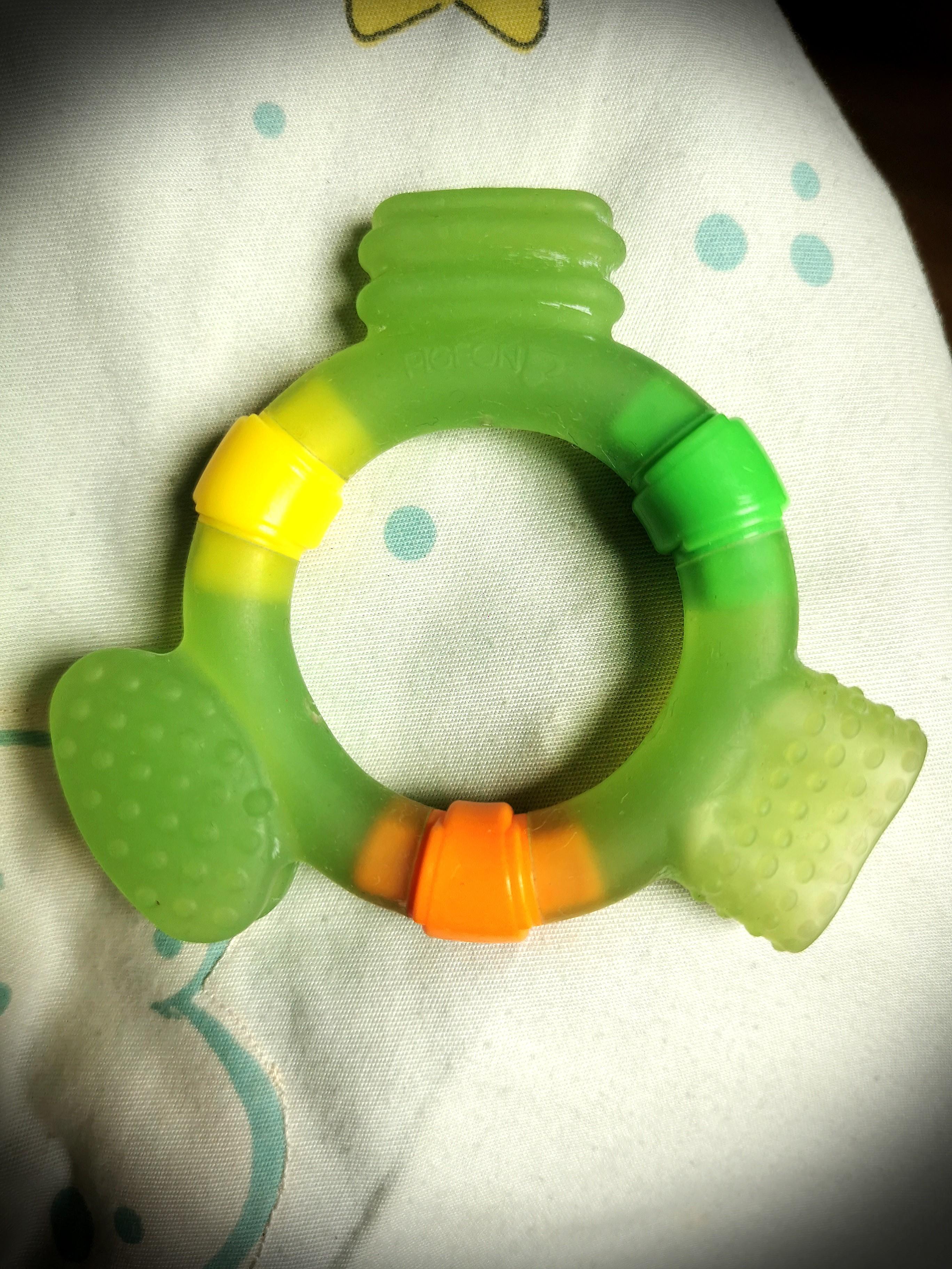 Pigeon Teether (Category: Soothers & Pacifiers) located in Pasig City. Submitted by cassidys_closet (Listing ID 1090719048, Image 2). Description: Teether Step 2 has soft handle and teething pad to prevent choking. It also has different shapes and thickness to bite and promote chewing and strong color scheme to attract baby. • Soft handle and teething pad to prevent choking • Different shapes and thickness to bite and promote chewing • Strong col