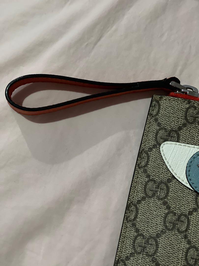 Gucci GG Supreme Cat Wristlet (Category: Luxury Bags & Wallets) located in Quezon City. Submitted by missalex87 (Listing ID 1090826154, Image 2). Description: this is a GUCCI Supreme GG cat wristlet from Gucci Kids. can be used as a wristlet (for money) or a pouch . not only for kids but for adults too :) in very good condition dimensions are : H 12 cm W 18 cm this is a flat pouch made with leather and coated canvas with stud eyes for more inquir
