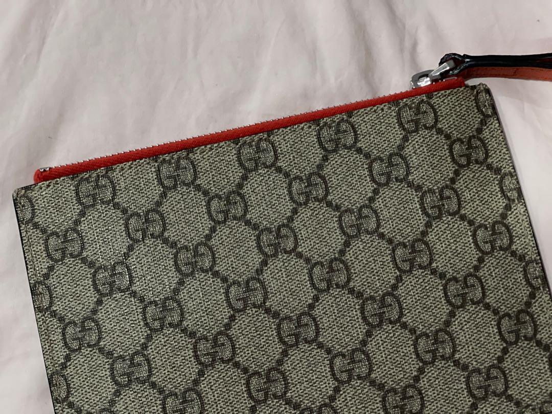 Gucci GG Supreme Cat Wristlet (Category: Luxury Bags & Wallets) located in Quezon City. Submitted by missalex87 (Listing ID 1090826154, Image 3). Description: this is a GUCCI Supreme GG cat wristlet from Gucci Kids. can be used as a wristlet (for money) or a pouch . not only for kids but for adults too :) in very good condition dimensions are : H 12 cm W 18 cm this is a flat pouch made with leather and coated canvas with stud eyes for more inquir