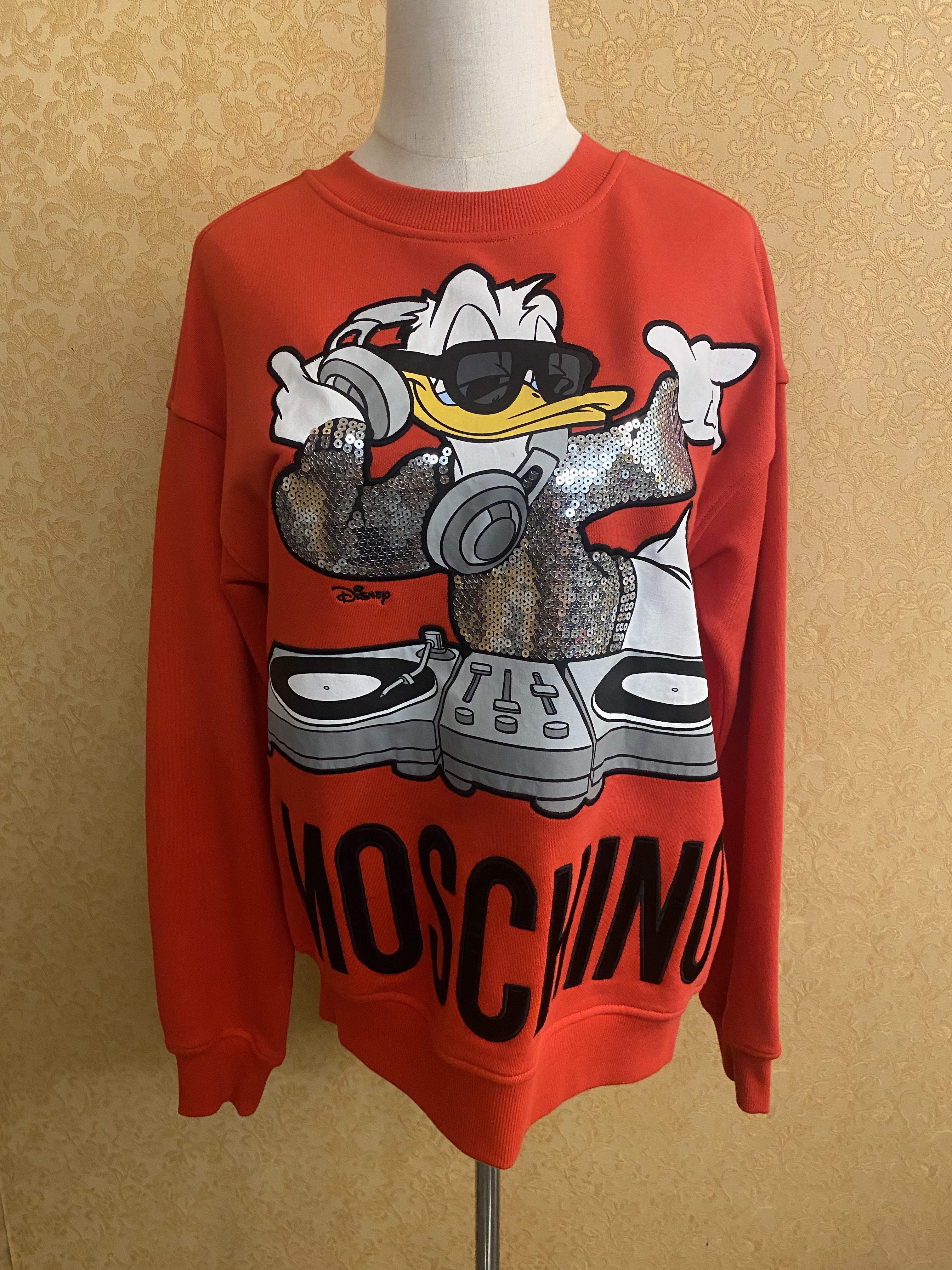 Red donald duck sweater hotsell