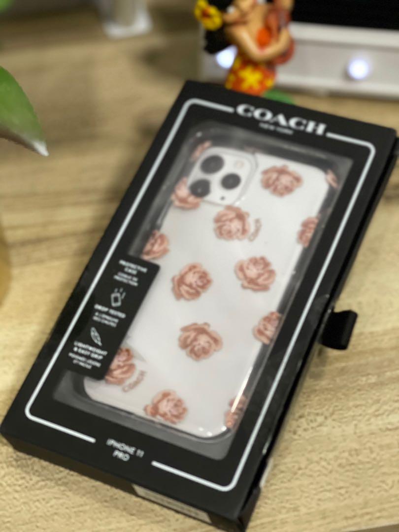 Beautiful 💐 Authentic COACH iPhone 11 Pro case (Category: Cases & Sleeves) located in Marikina City. Submitted by girlbalikbayan (Listing ID 1085546737, Image 2). Description: Does mom/wifey have an iPhone 11 Pro? Then give her a piece of luxury with this COACH protective mobile phone case. 🔘Styled with pretty signature Coach graphics and patterns - Dreamy Peony Clear/Pink 🔘Drop Tested 🔘Shock-Resistant 🔘Wireless Charging Compatible 🔘Lightwe