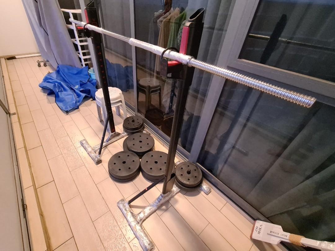 Weights Set (Category: Weights & Dumbbells) located in Singapore. Submitted by friendlycarooseller (Listing ID 1085833413, Image 1). Description: Squat rack (up to 100kg) + 100kg of PVC coated weights (2x15kg, 4x10kg, 2x7.5kg, 2x5kg, 5kg 1.8m bar) Condition 7/10, barbell and squat rack rusted in some areas due to use in balcony. Weights very good condition. Bar is thinner diameter than Olympic bar. Rack adjustable height 75cm - 110cm. Not ideal f