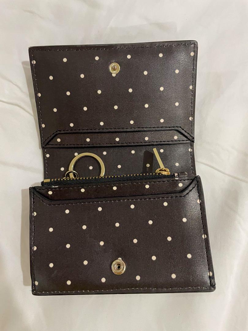Authentic Kate Spade Wallet (Category: Wallets & Card holders) located in Cavite. Submitted by theadee (Listing ID 1086215854, Image 3). Description: AUTHENTIC compact kate spade wallet, perfect for small bags Condition: 8/10 (ID slot is just a bit dirty, but can be cleaned with wipes or alcohol) Original Price: 3500 (bought at 158 designers blvd @ATC.