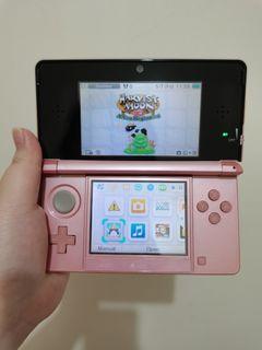 Light Pink Nintendo 3ds with games
