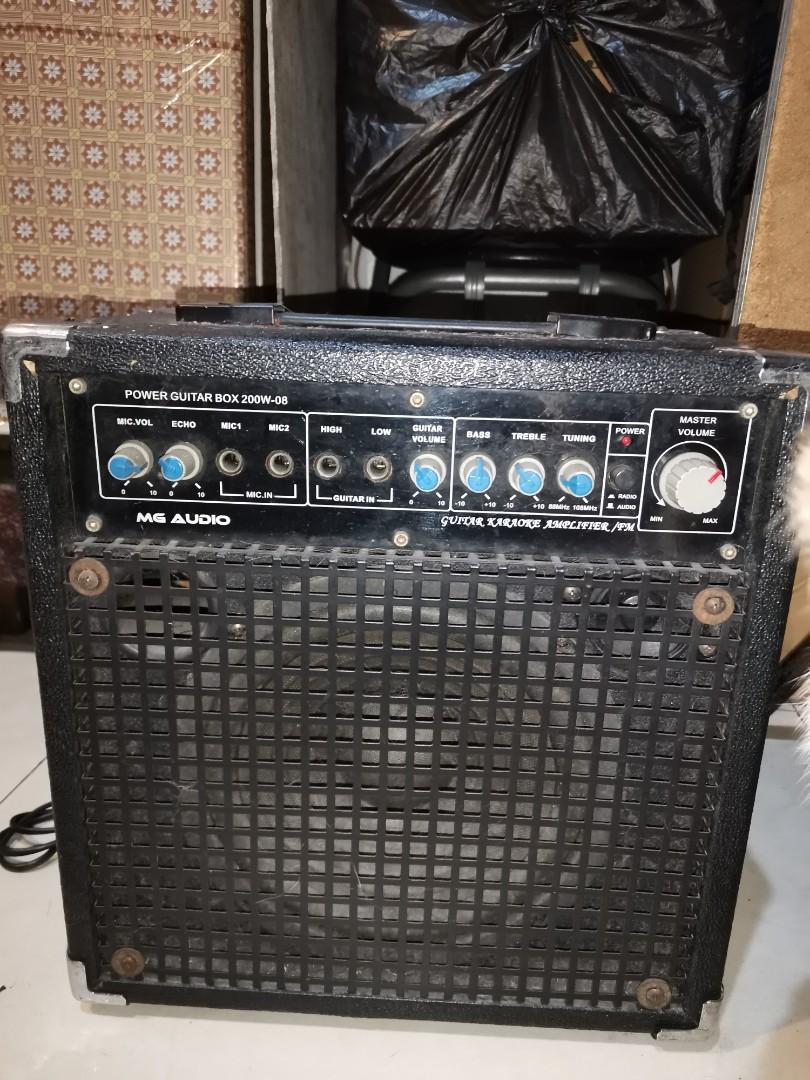 MG Audio Guitar Karaoke Amplifier/FM (Category: Soundbars, Speakers & Amplifiers) located in Manila. Submitted by evrtorres (Listing ID 1086266279, Image 1). Description: Still works perfectly fine. Last time I used it was few weeks ago. Plugged in my guitar and the sound quality is great. Sampaloc area..