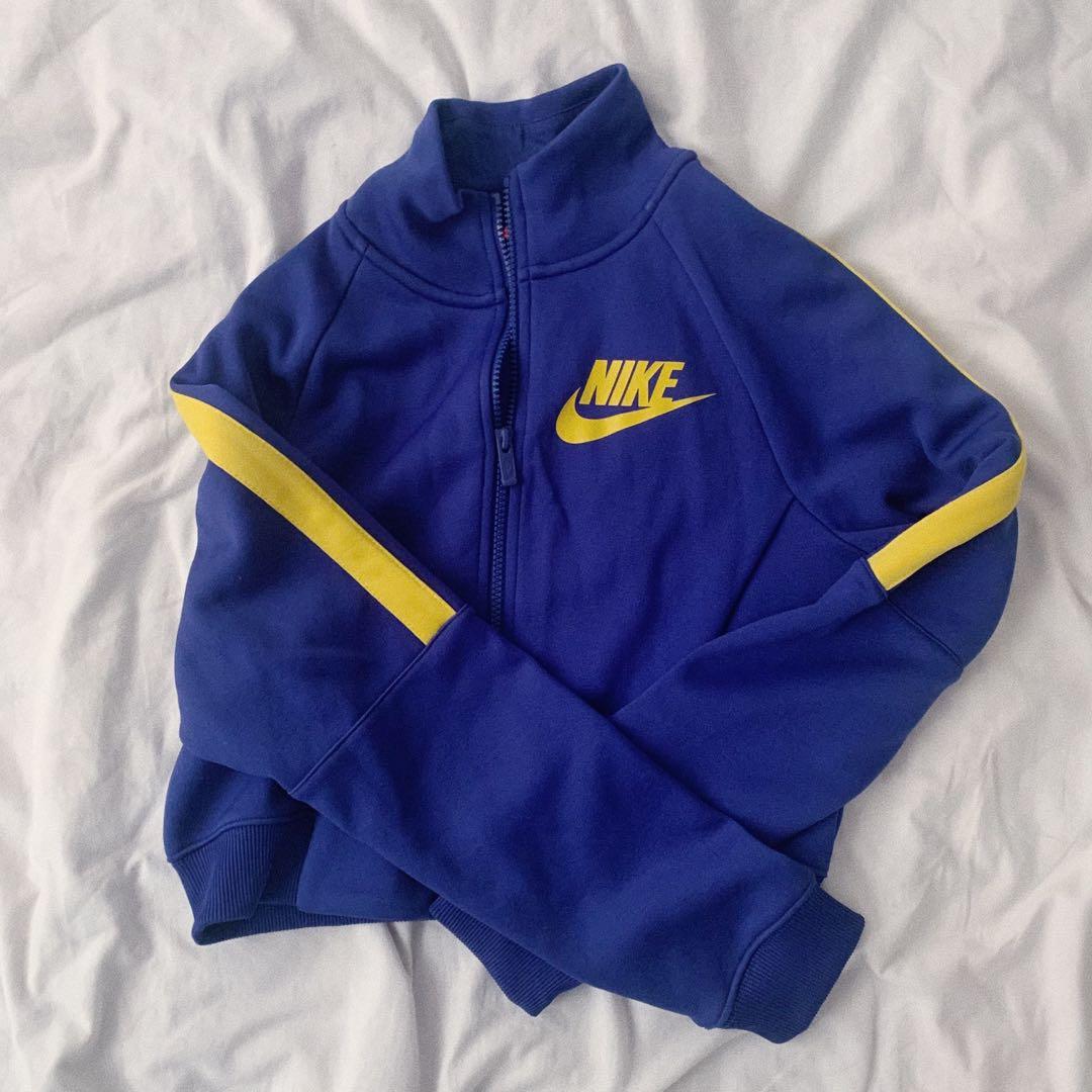 nike cropped track jacket in blue and yellow Women s Fashion