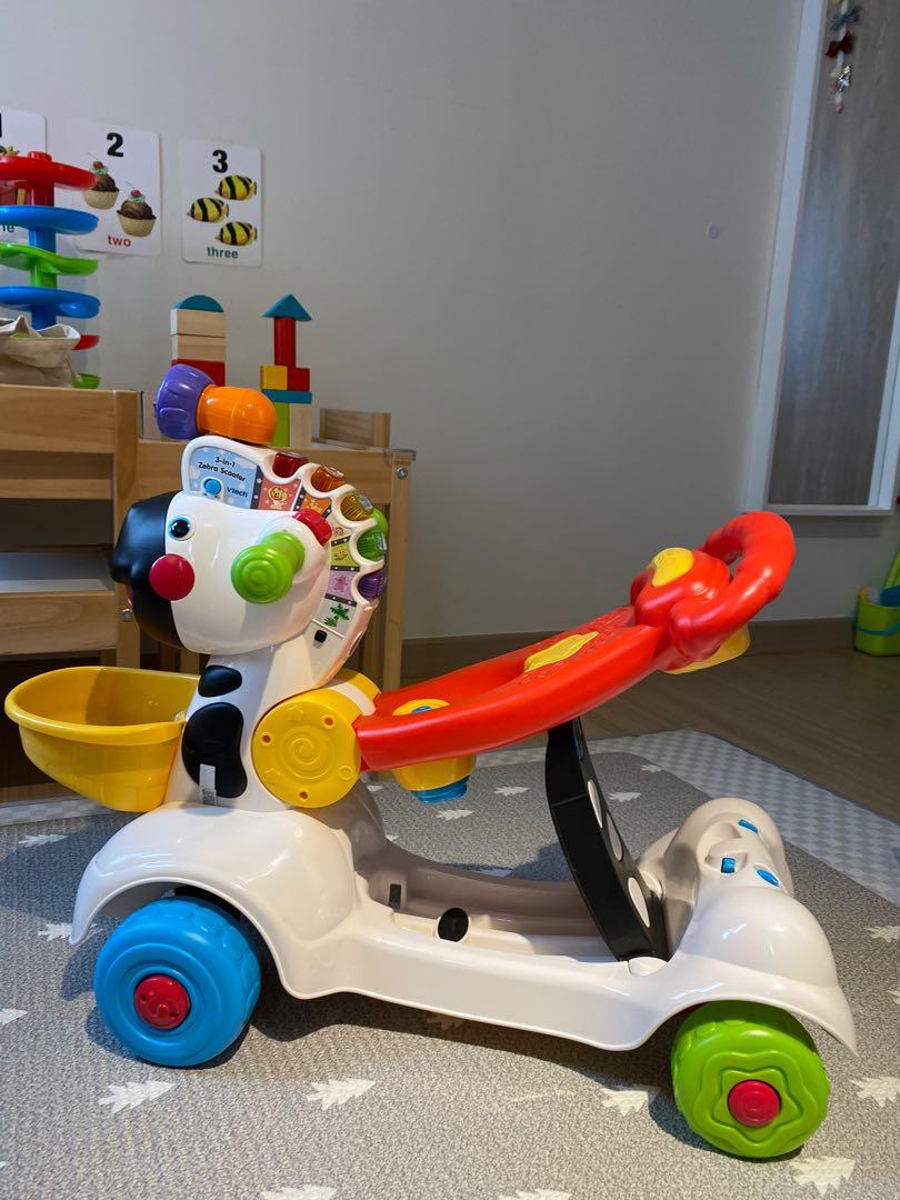 Fisher price zebra scooter store