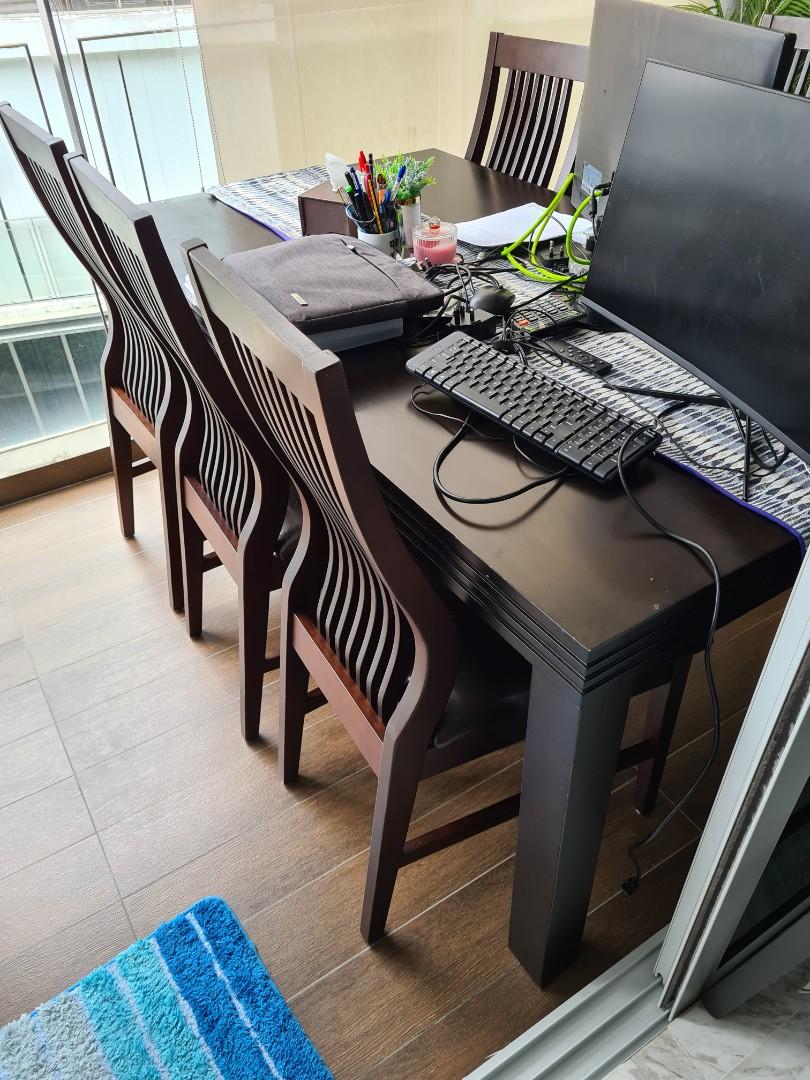 Dining table (Category: Tables & Sets) located in Singapore. Submitted by ravleeeeen (Listing ID 1086659434, Image 1). Description: QUICK SALE COLLECTION ASAP solid teakwood table, very sturdy. comes with 6 chairs. not for fussy buyer as the table has some scratches. Length 165cm Width about 96cm Height 74cm.