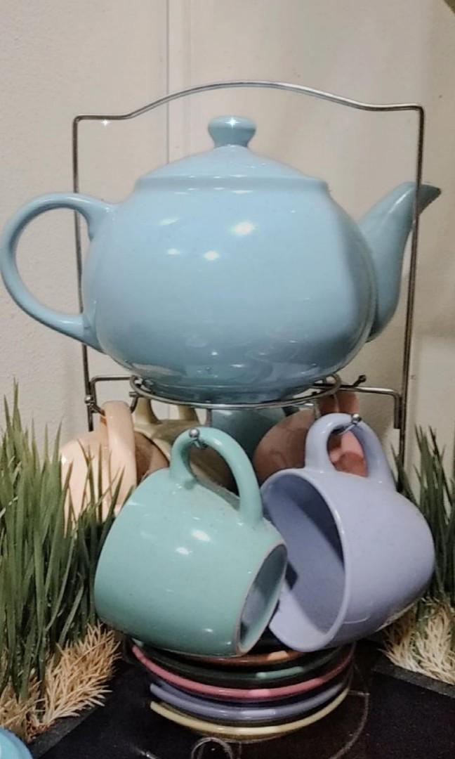 CERAMIC TEA SET W/ CUP,KETTLE,SAUCER (Category: Dinnerware & Cutlery) located in Makati City. Submitted by marcie_i (Listing ID 1091415419, Image 2). Description: Made of Ceramic includes 1 kettle 6 cups 6 saucers 1 rack.