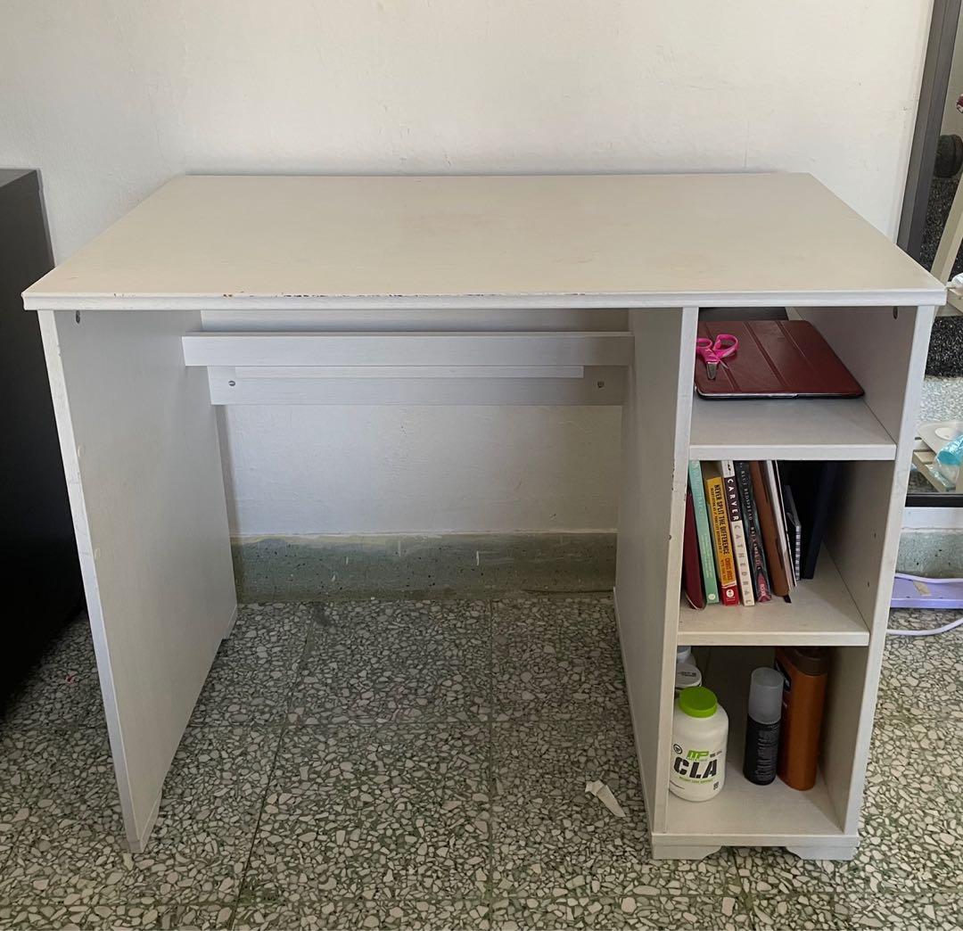 IKEA Study Table (Category: Tables & Sets) located in Singapore. Submitted by tiongbahrucat (Listing ID 1091306985, Image 1). Description: Easily dismantled and can fit into a taxi ❤️ Extension cord holder for cables. Convenient to use for laptop charger, phone chargers, etc ❤️ 3 large shelves to store items ❤️ Good condition with wear and tear as pictured ❤️ 90x70x52cm Pickup at anytime from Tiong Bahru Yong Tao Hu. Priced to clear urgently. U.P