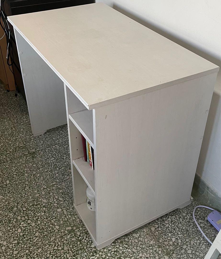 IKEA Study Table (Category: Tables & Sets) located in Singapore. Submitted by tiongbahrucat (Listing ID 1091306985, Image 2). Description: Easily dismantled and can fit into a taxi ❤️ Extension cord holder for cables. Convenient to use for laptop charger, phone chargers, etc ❤️ 3 large shelves to store items ❤️ Good condition with wear and tear as pictured ❤️ 90x70x52cm Pickup at anytime from Tiong Bahru Yong Tao Hu. Priced to clear urgently. U.P