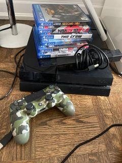 Ps4 with 4 disc games a ps4 controller and a ps4 camera