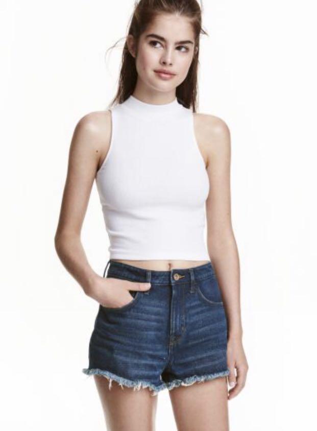 white turtleneck sleeveless top