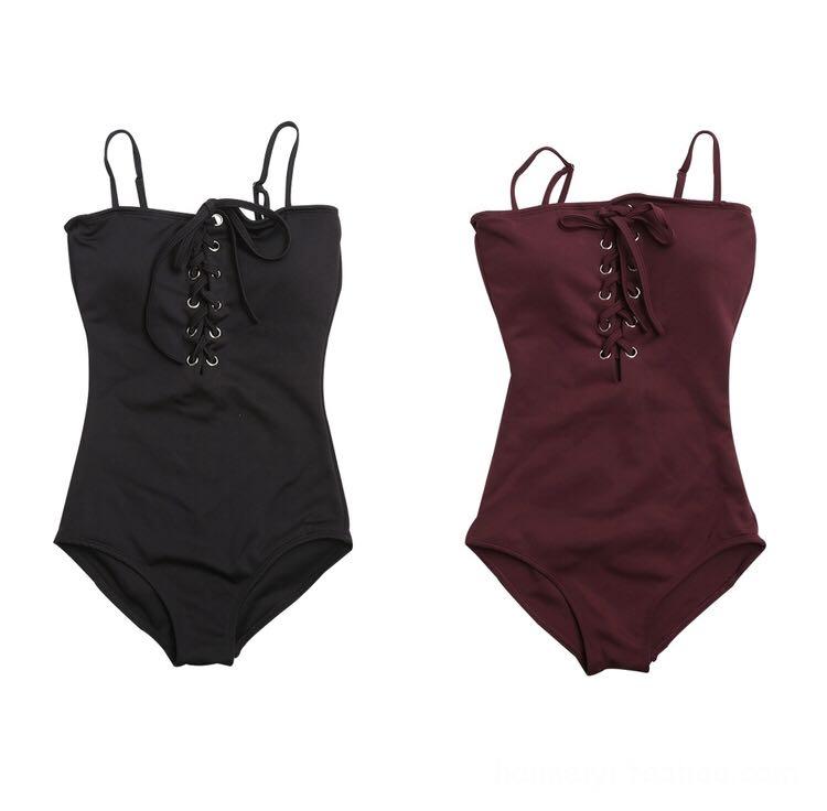 Black swimming costume with belt clearance