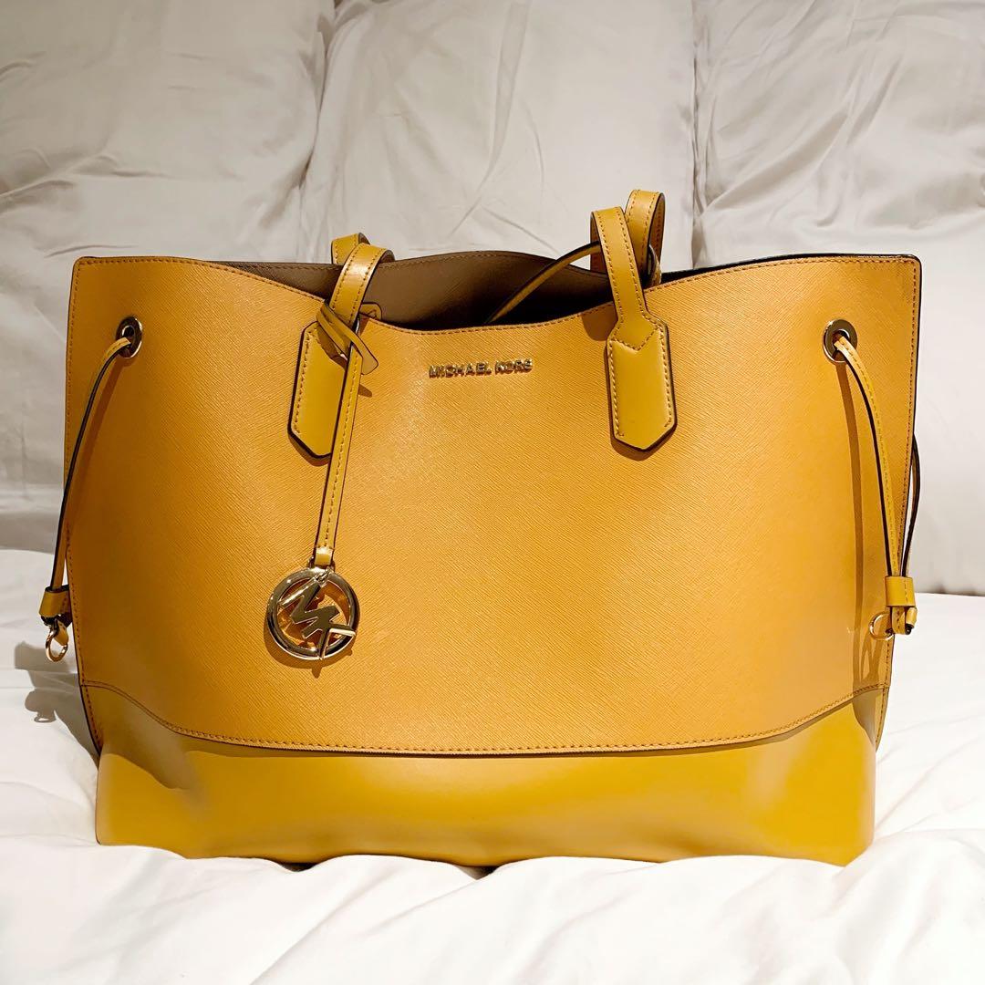 Thrifty Shopper  This yellow Michael Kors bag is the perfect summer  accessory Big enough to fill with all of your essentials and stylish  enough to wear with any outfit  Stop