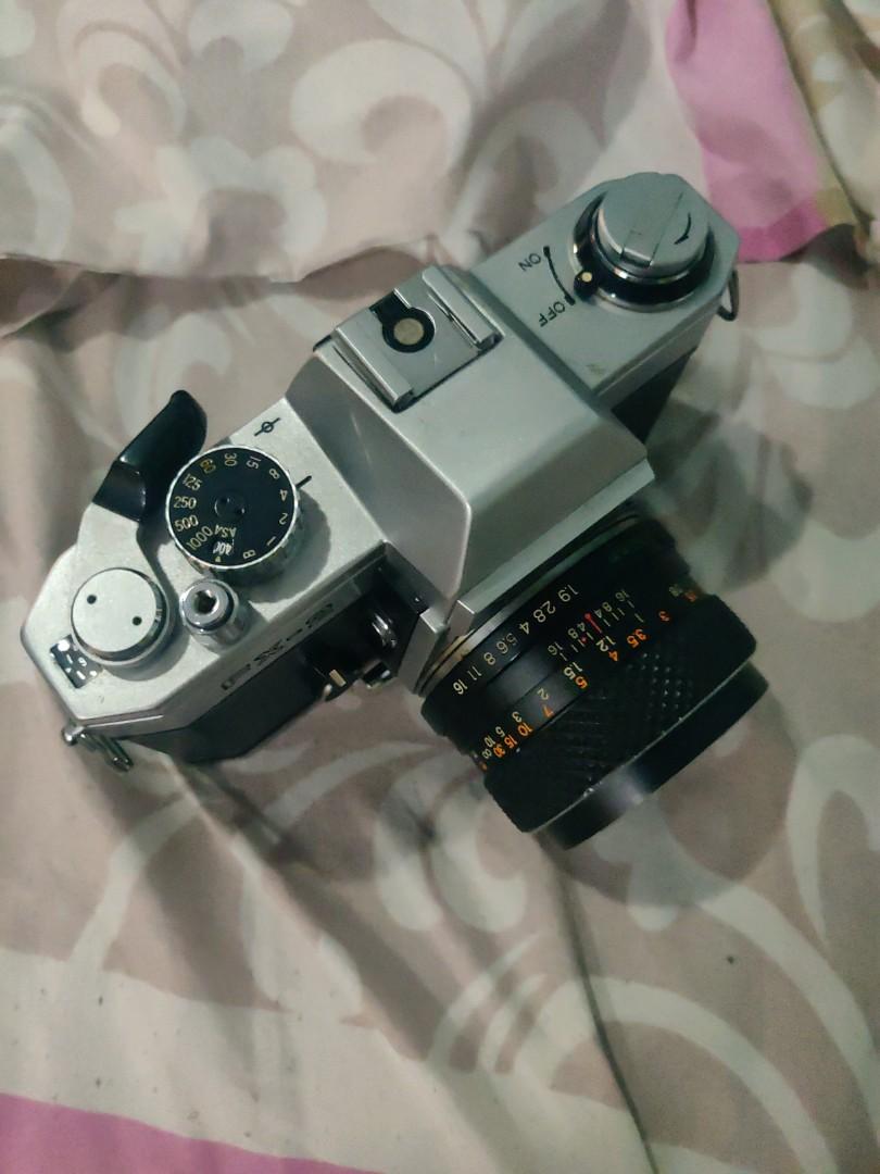 Yashica FX-2 (Category: Cameras) located in Manila. Submitted by conniev (Listing ID 1093624043, Image 2). Description: Yashica FX-2 with Yashica 50mm 1.9 lens. I don't know if it is working. I bought it 2nd hand for P2,500.00 for props for a pictorial shoot..