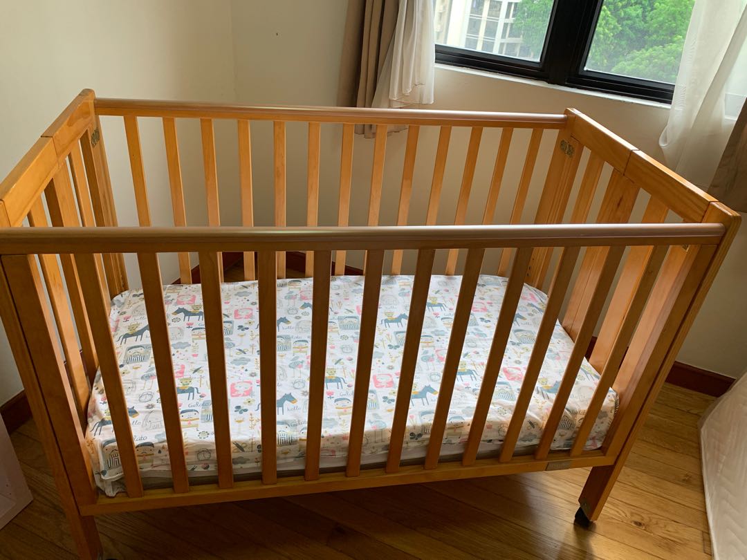 Babyhood cot (mother care) on wheels, Babies & Kids, Baby Nursery