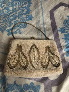 Vintage clutch bag made of gold and white beads