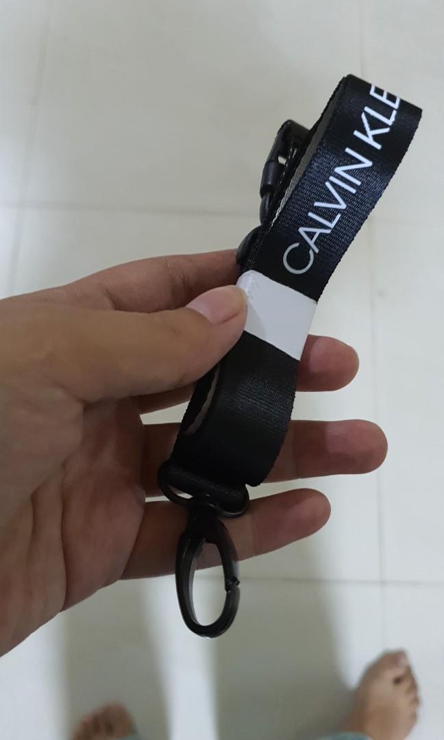 Calvin Klein Lanyard, Men's Fashion, Bags, Belt bags, Clutches and Pouches  on Carousell