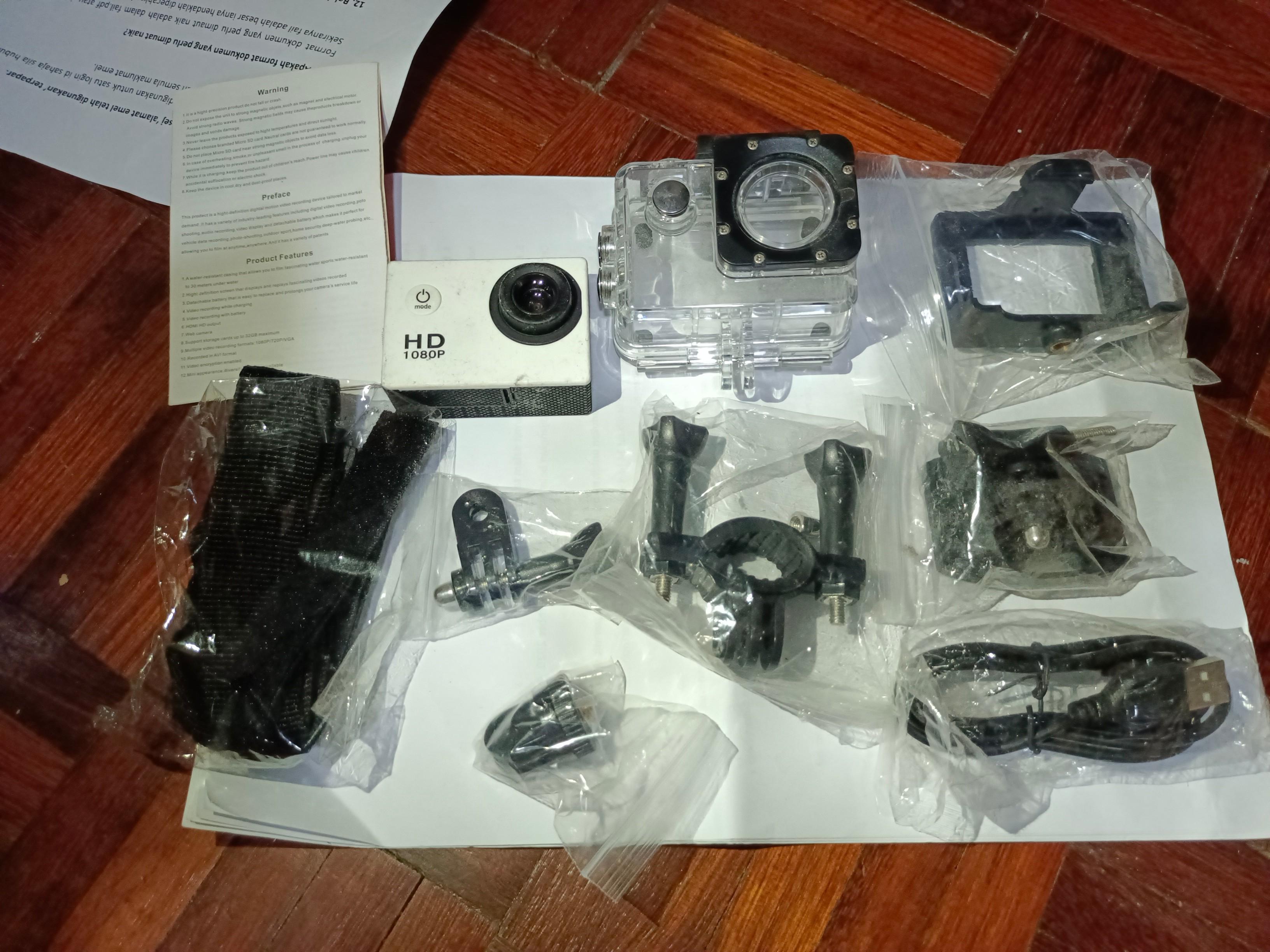 Action Camera (Category: Cameras) located in Kuala Lumpur. Submitted by jemin (Listing ID 1094507526, Image 1). Description: New set with helmet mount and underwater casing and tripod holder and bicycle handle grip and the rest not sure what is it. Bought it never use. Quite wasted..