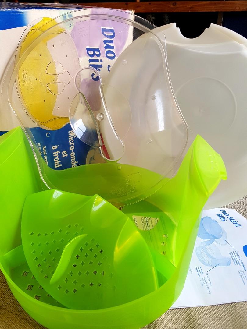 Baby bottle sterilizer (Category: Breastfeeding & Bottle Feeding) located in Quezon City. Submitted by kirstenbella (Listing ID 1094657168, Image 2). Description: Baby bottle microwavable sterilizer - Brand: BeBe Comfort - made in France padala - never used just stored - Baby bottle storage - Suitable fits most microwave - large capacity allow you to charge universal bottles in the basket - sterilizes bottles and accessories in less that 3 minute