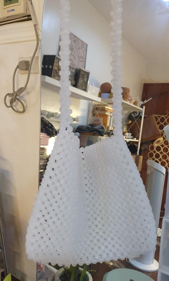 Handmade Bead Bag (White) (Category: Shoulder Bags) located in Manila. Submitted by decluttermystuff21 (Listing ID 1094907378, Image 2). Description: Handmade by me Never used. Just wanted to try bead crafting when it was trendy Approximately 17cm × 21cm Will bundle both handmade bead bags for Php 500 only.