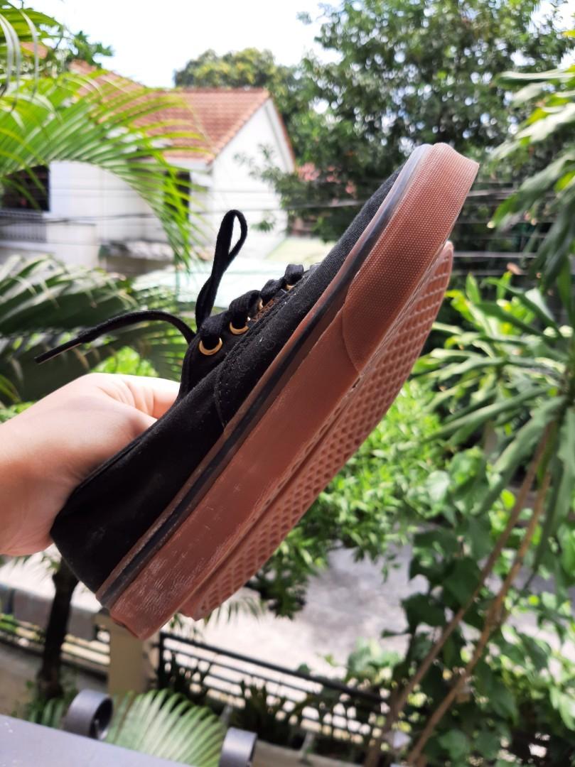 Black vans with brown rubber soles
