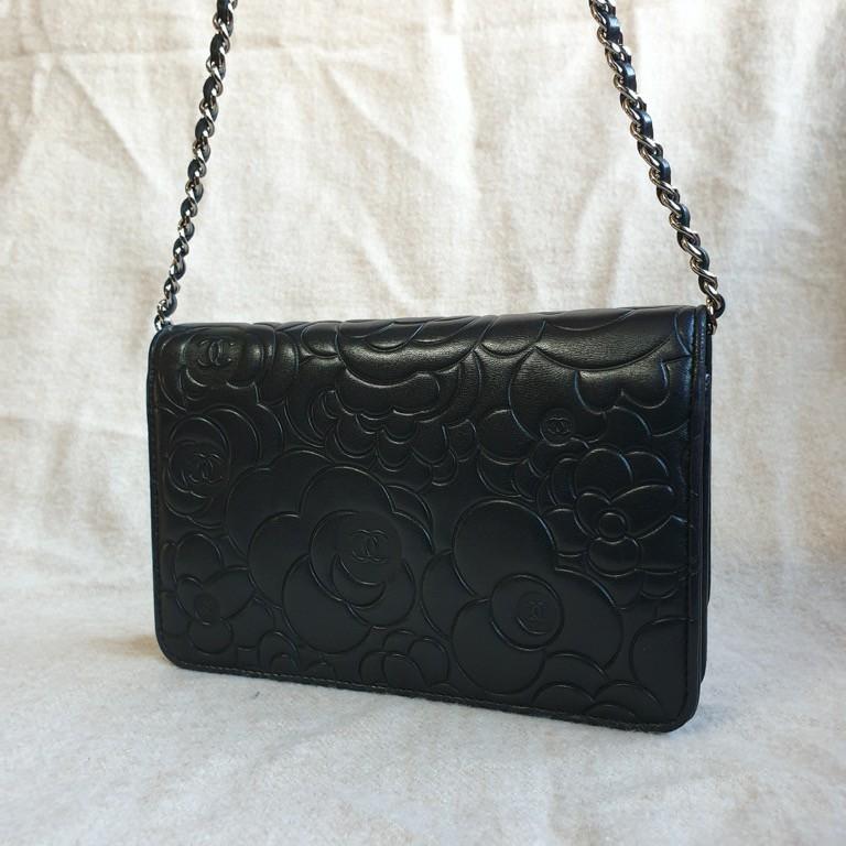 Chanel Black Lambskin Camellia Embossed Clutch Bag, Luxury, Bags & Wallets  on Carousell