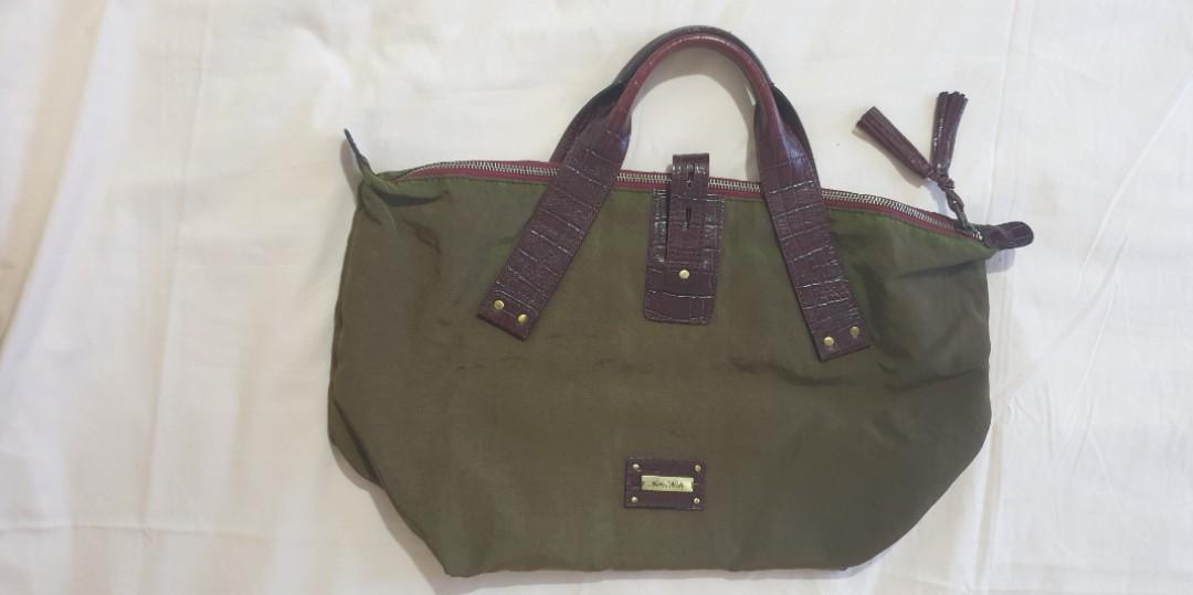 Fino Nylon Bag with Leather Trimmings (Category: Luxury Bags & Wallets) located in Makati City. Submitted by belle_ame_67 (Listing ID 1095115777, Image 1). Description: Authentic Fino Nylon Bag with Leather Trimmings With sign of usage RFS: Decluttering.