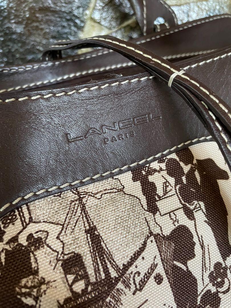Lancel Paris travel bag (Category: Luxury Bags & Wallets) located in Paranaque City. Submitted by riceywicey (Listing ID 1095063205, Image 2). Description: -Original -Spacious, sturdy travel bag -Minor wear: missing a metal pendant lock on one of the strings but barely noticeable (see photo for reference).