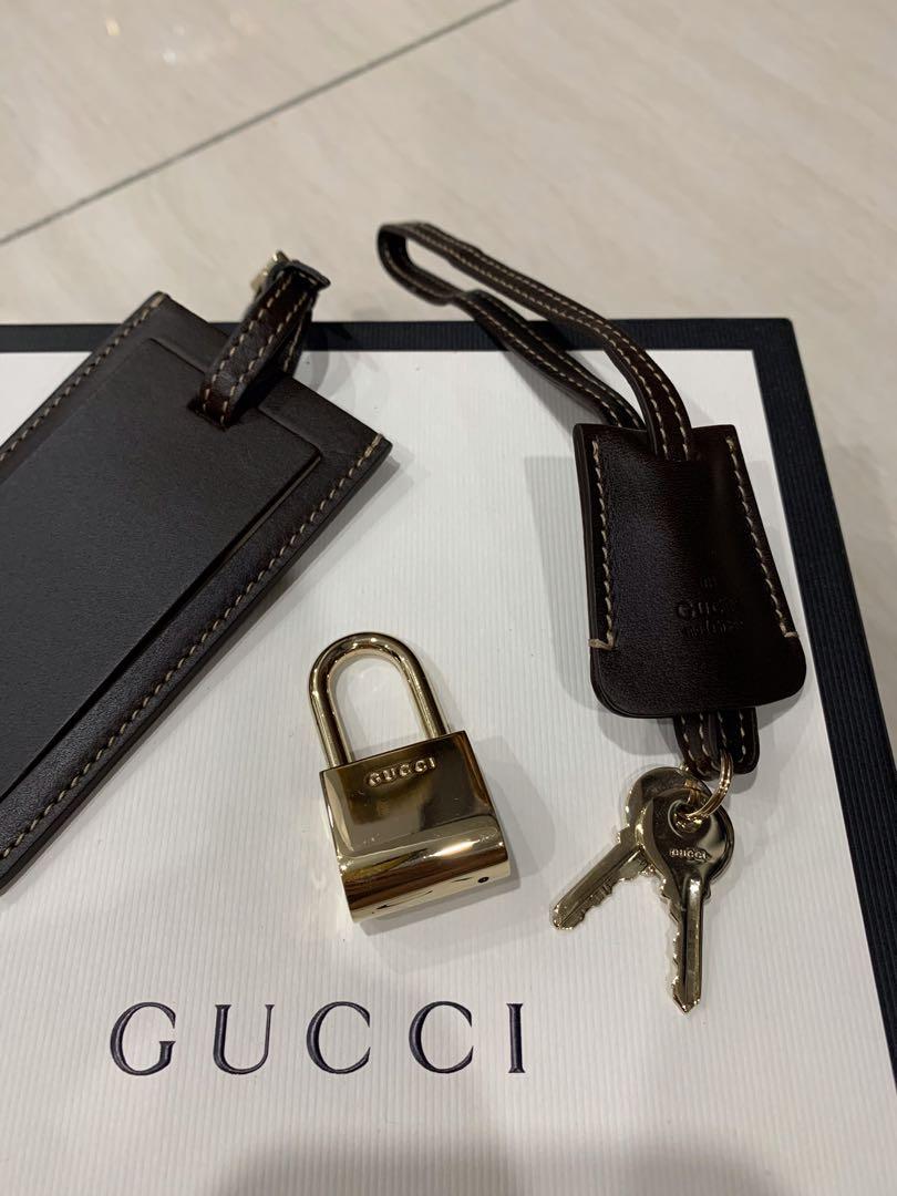 Authentic Gucci leather luggage tag and padlock with keys, Luxury,  Accessories on Carousell