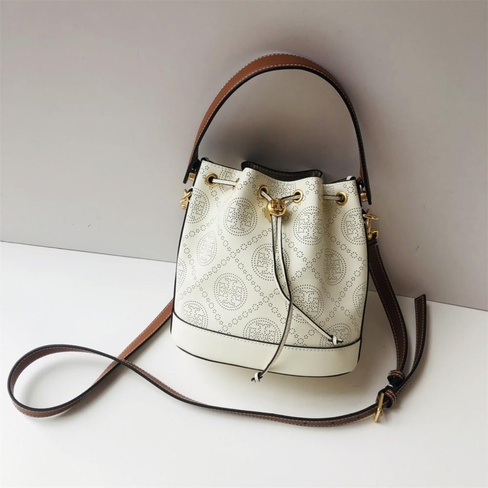 Tory Burch T Monogram Perforated Leather Bucket Bag, Women's Fashion, Bags  & Wallets, Purses & Pouches on Carousell