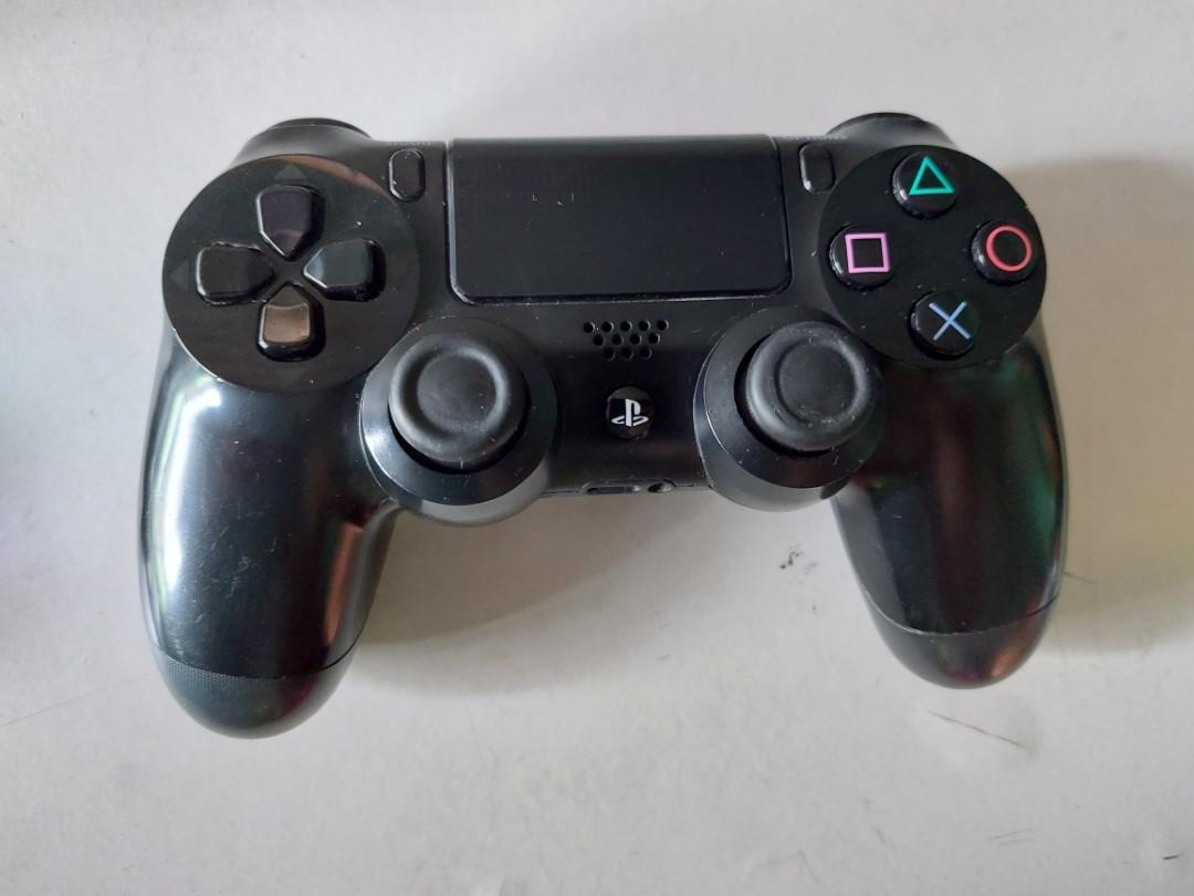 PS4 controller (black) original, preloved (Category: Controllers) located in Manila. Submitted by prettypr1ncess (Listing ID 1091573435, Image 1). Description: Original PS4 controller - preloved Working Issue: - hitches in movement - slow when looking right - moves left when pressing R2 location: pasig manggahan shipping c/o buyer shopee checkout available.