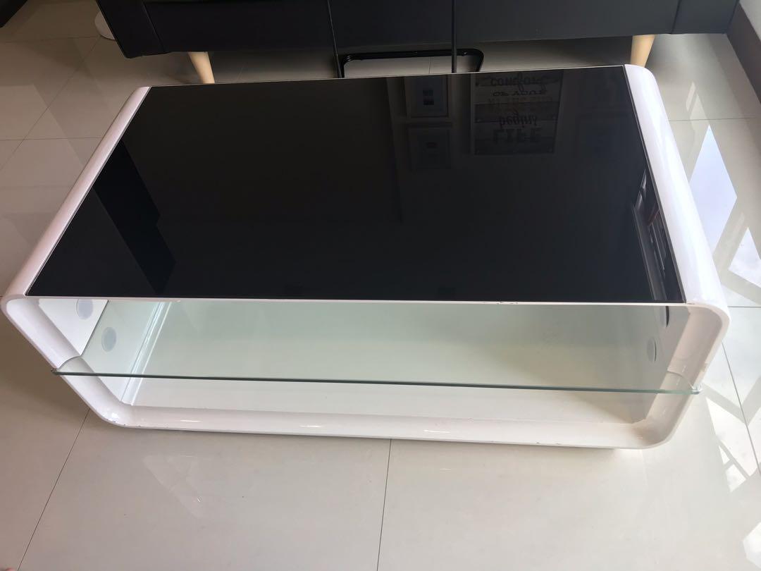 Coffee table (Category: Tables & Sets) located in Singapore. Submitted by rykm154 (Listing ID 1095506939, Image 1). Description: Selling off this great-looking coffee table with tempered glass surface. It also comes with shelves below to put things such as newspapers, magazines.... Selling because I am moving house. Hurry! Grab it before it’s gone. .