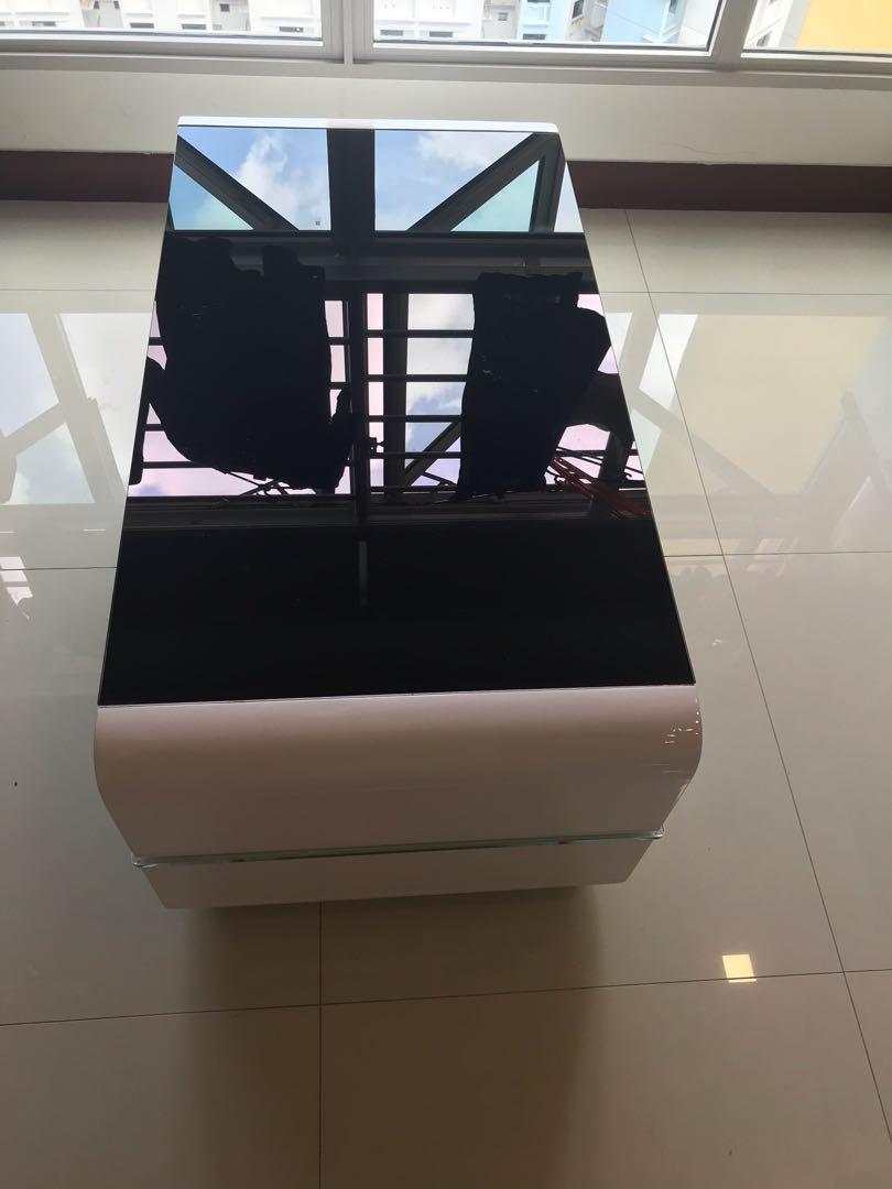 Coffee table (Category: Tables & Sets) located in Singapore. Submitted by rykm154 (Listing ID 1095506939, Image 3). Description: Selling off this great-looking coffee table with tempered glass surface. It also comes with shelves below to put things such as newspapers, magazines.... Selling because I am moving house. Hurry! Grab it before it’s gone. .