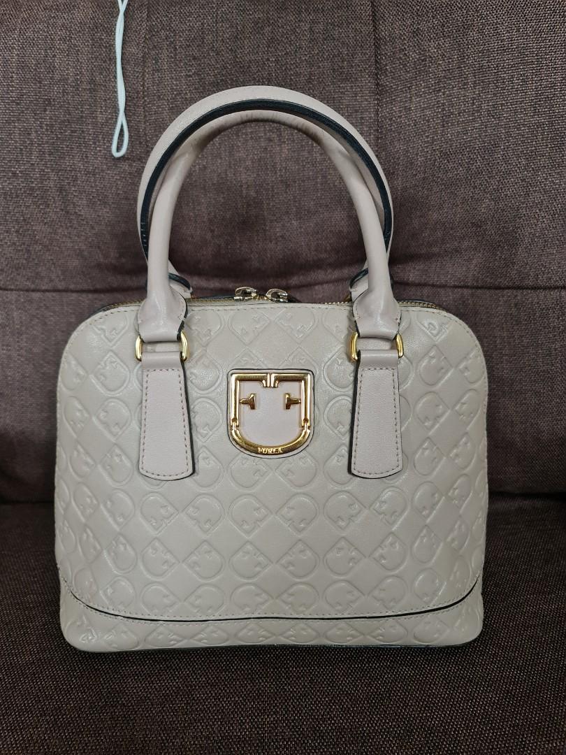 Furla bag with sling (Category: Luxury Bags & Wallets) located in Quezon City. Submitted by cherry_hailey (Listing ID 1095773769, Image 1). Description: Pre loved Authentic Fantastica Dome with strap and dust bag.