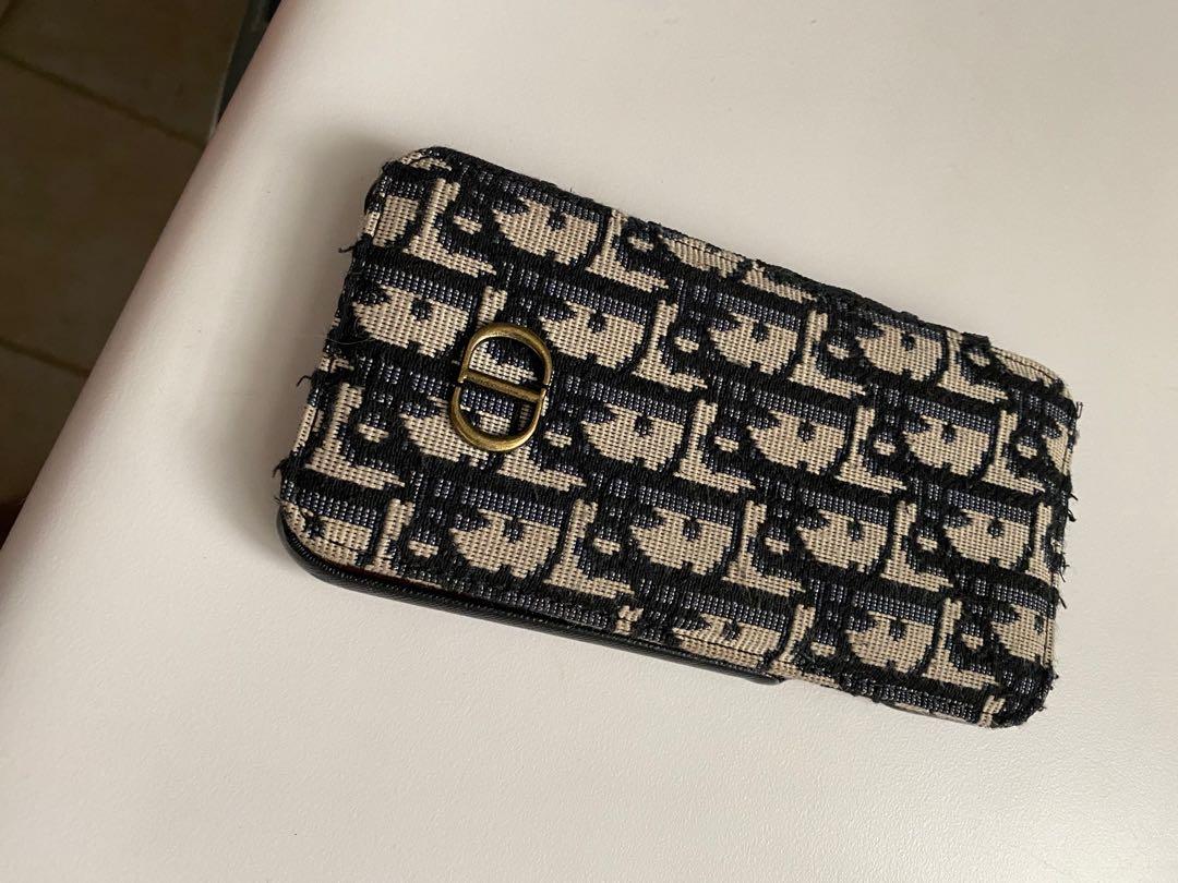 CD phone case (Category: Accessories) located in Richmond Hill. Submitted by ele30 (Listing ID 1096070575, Image 1). Description: It’s for an iPhone 11 (Christian Dior ) has credit card storage .