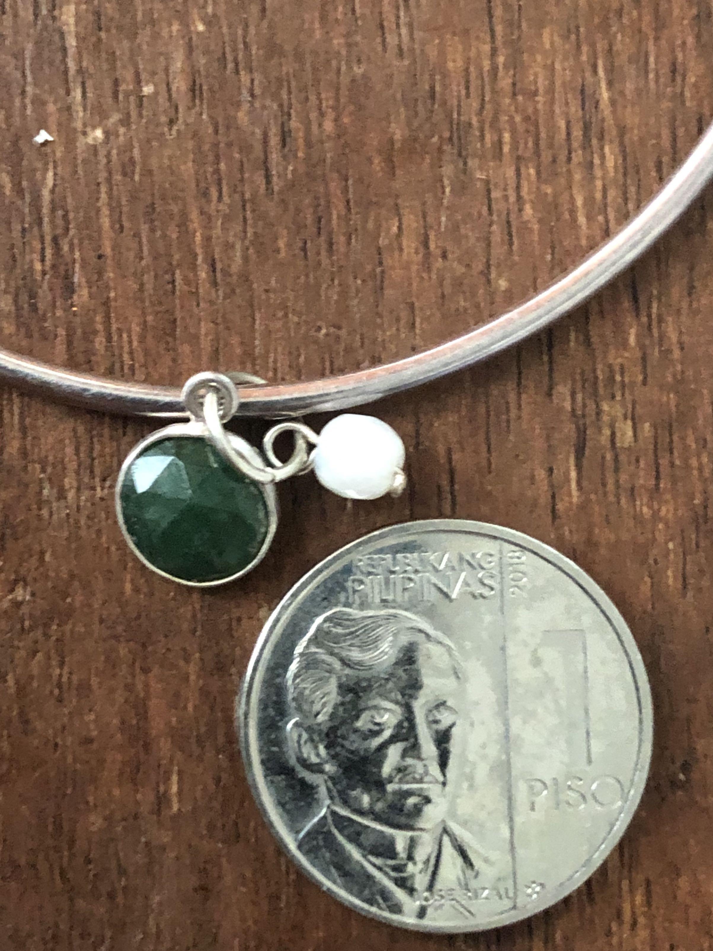 Silver bangle with Emerald and pearl (Category: Bracelets) located in Muntinlupa City. Submitted by declutter_with_me (Listing ID 1095888854, Image 2). Description: 92.5 Silver bangle with Emerald and fresh water pearl charms.