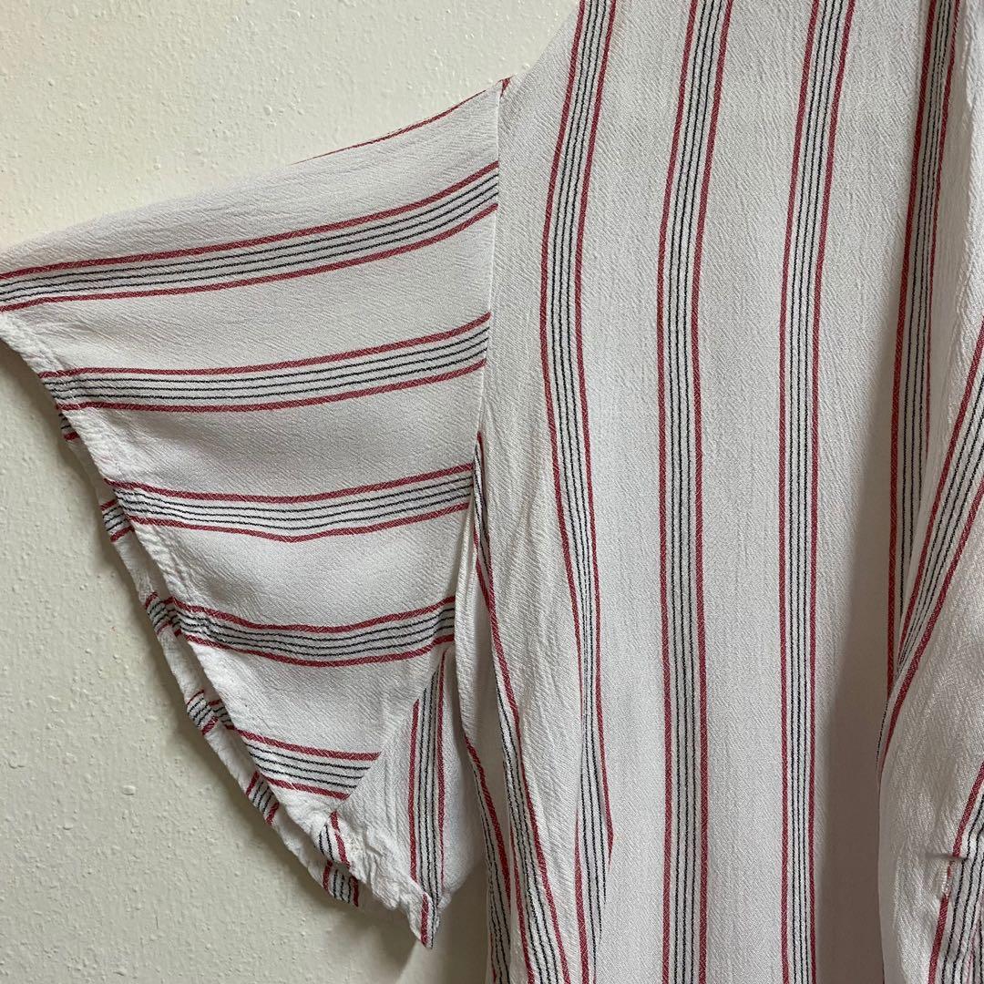 MANGO Striped Short Sleeve Buttondown (Category: Blouses) located in Angeles City. Submitted by chaqi (Listing ID 1096220223, Image 3). Description: ✨ decluttering sale ✨ MANGO Striped Short Sleeve Buttondown with flared-like sleeves detailing flaws: stain (see photo).