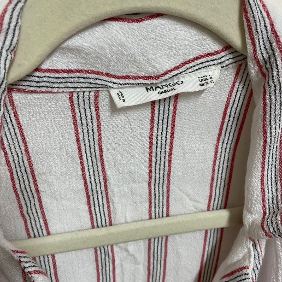 MANGO Striped Short Sleeve Buttondown (Category: Blouses) located in Angeles City. Submitted by chaqi (Listing ID 1096220223, Image 2). Description: ✨ decluttering sale ✨ MANGO Striped Short Sleeve Buttondown with flared-like sleeves detailing flaws: stain (see photo).