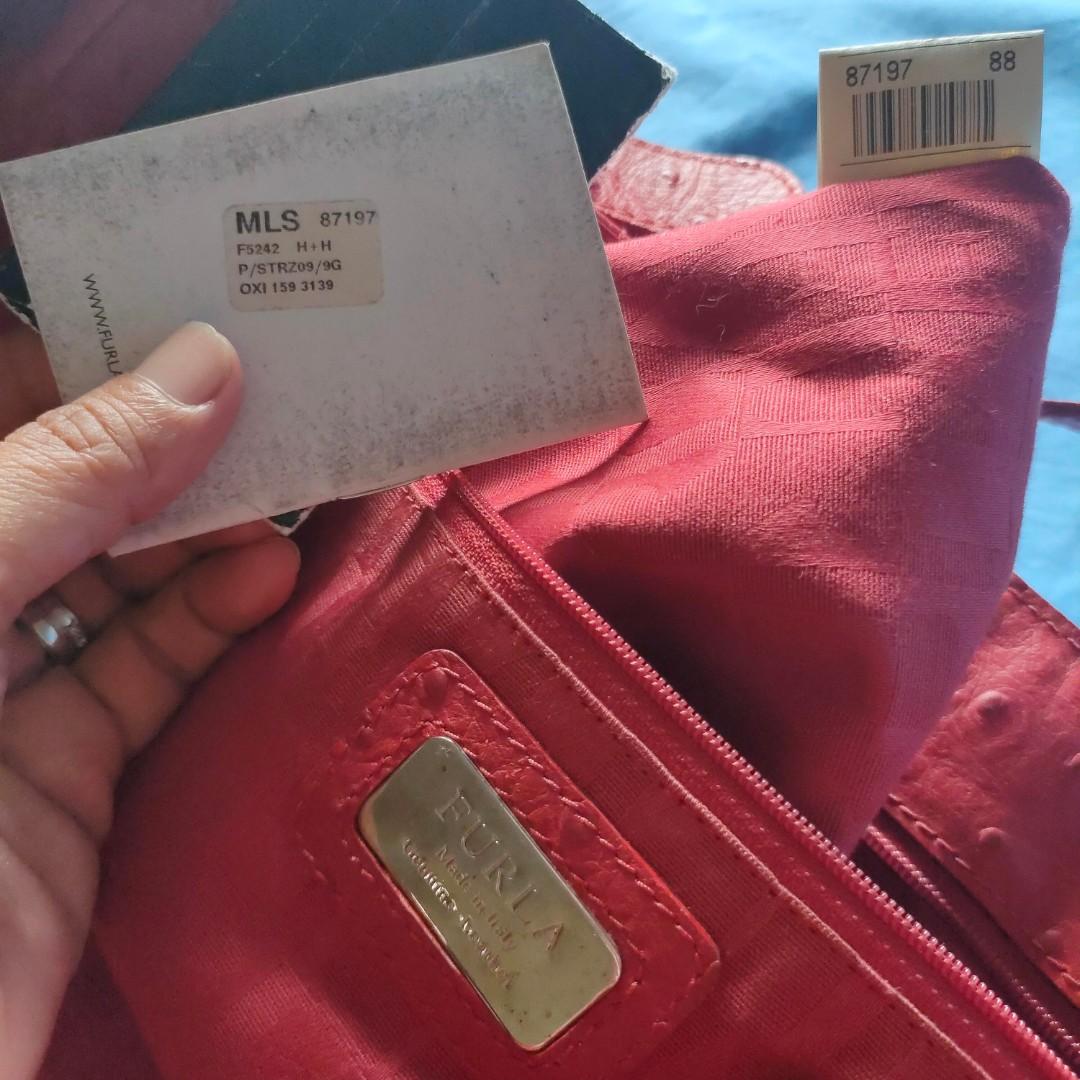Furla Ostrich Leather Red 3-way (Category: Shoulder Bags) located in Muntinlupa City. Submitted by cassava_ph (Listing ID 1096371702, Image 2). Description: Authentic Furla - 3-way: expandable handbag, shoulder bag, sling bag - With code and authenticity cards - size large : 18.5x11x7inches - excellent hardwares - adjustable sling - normal usage signs on handle but intact rubber lining, in sturdy condition. please feel free to pm me :)).