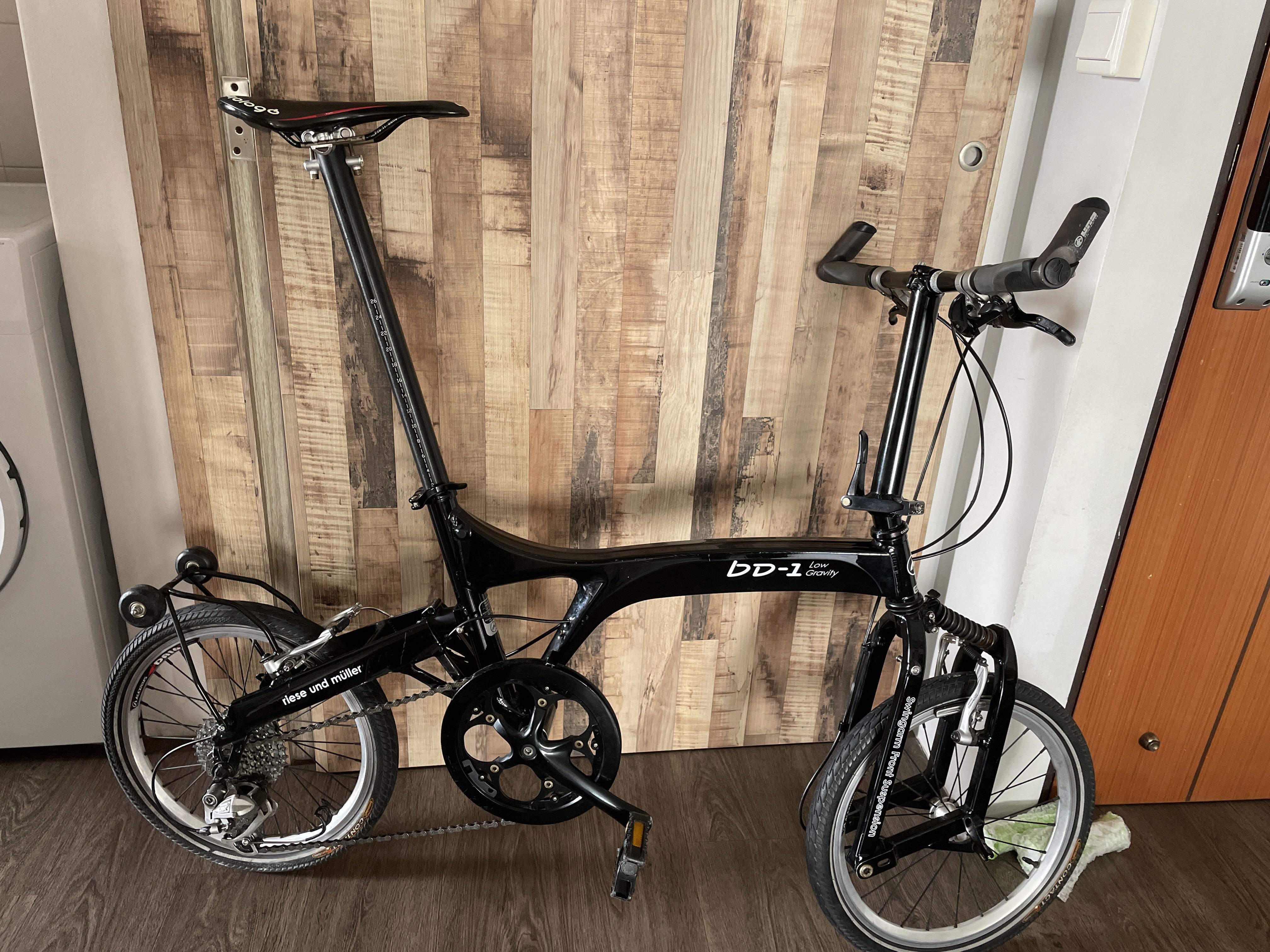 Gravity folding bike store
