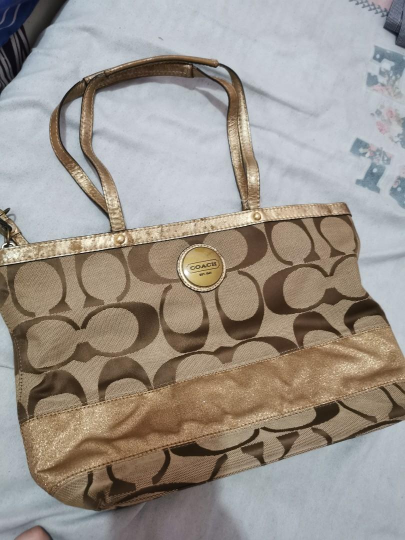 Gold Coach Bag (Category: Luxury Bags & Wallets) located in Quezon City. Submitted by professional.declutterer (Listing ID 1096829723, Image 1). Description: Coach Hand Bag 2nd owner, bought from a reputable seller RFS: Not used anymore (used for several times only), funding for baby items/vaccines MOP: BDO/BPI/Gcash/Paymaya Location: QC near Fishermall Grab/Lalamove/Mr. Speedy sf c/o buyer.