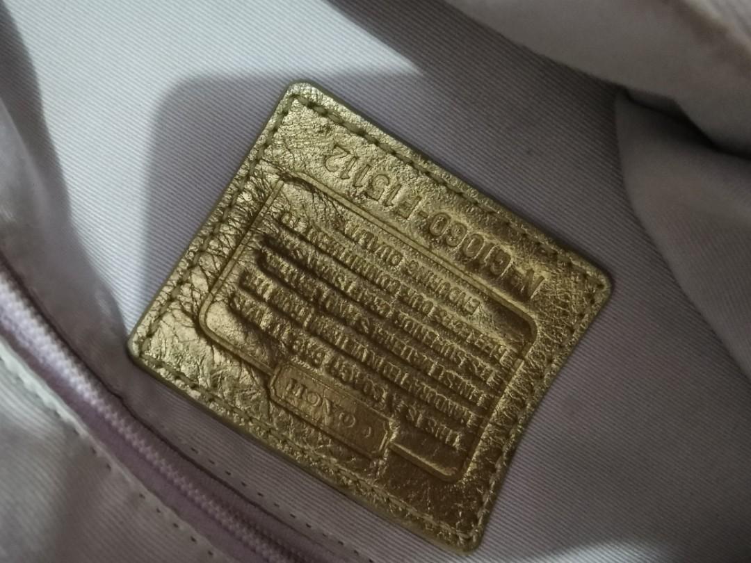 Gold Coach Bag (Category: Luxury Bags & Wallets) located in Quezon City. Submitted by professional.declutterer (Listing ID 1096829723, Image 3). Description: Coach Hand Bag 2nd owner, bought from a reputable seller RFS: Not used anymore (used for several times only), funding for baby items/vaccines MOP: BDO/BPI/Gcash/Paymaya Location: QC near Fishermall Grab/Lalamove/Mr. Speedy sf c/o buyer.