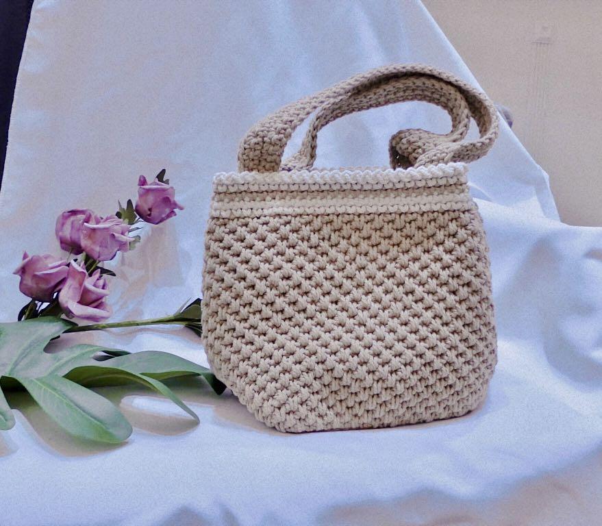 Premium Photo | Gray and brown handmade knitted bags on a gray background.  copy, empty space for text