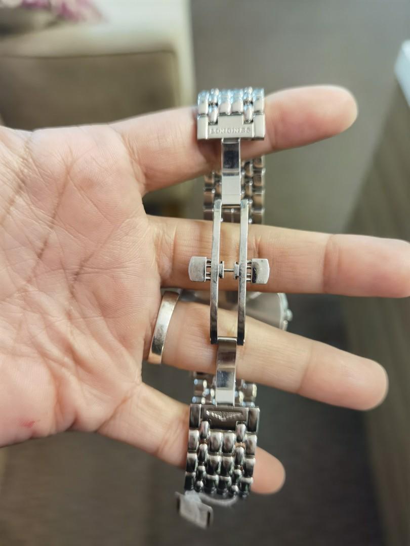 Prelove Longines (Category: Luxury Watches) located in Taguig. Submitted by mhalet.902 (Listing ID 1096761320, Image 2). Description: Gender: Men's Reference #: L4.801.4 Movement: Automatic Case Size: 38mm Case Material: Stainless steel Strap Size: 5.75" Crystal: Sapphire Dial Type/Color: Analog / Silver Water Resistance: 30m Calendar: Date display Band Type: Bracelet Band Material: Stainless steel Clasp: Butterfly Inclusion: None Detailed Item D