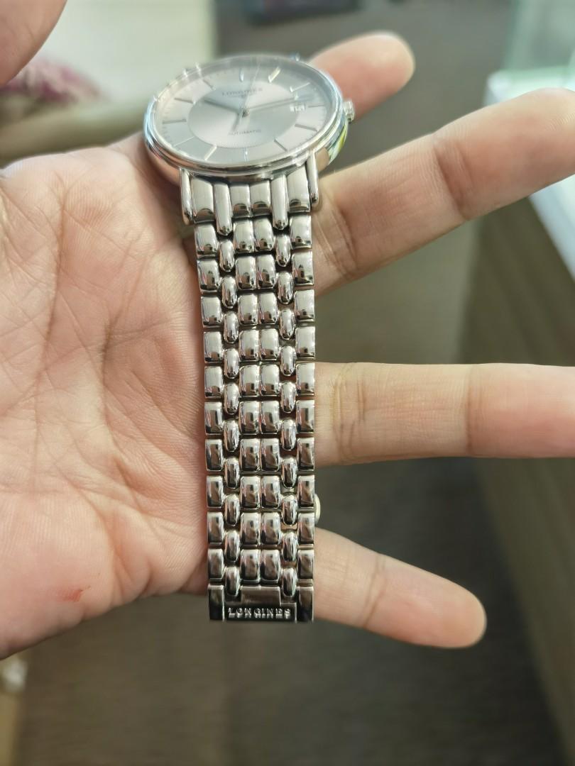 Prelove Longines (Category: Luxury Watches) located in Taguig. Submitted by mhalet.902 (Listing ID 1096761320, Image 3). Description: Gender: Men's Reference #: L4.801.4 Movement: Automatic Case Size: 38mm Case Material: Stainless steel Strap Size: 5.75" Crystal: Sapphire Dial Type/Color: Analog / Silver Water Resistance: 30m Calendar: Date display Band Type: Bracelet Band Material: Stainless steel Clasp: Butterfly Inclusion: None Detailed Item D