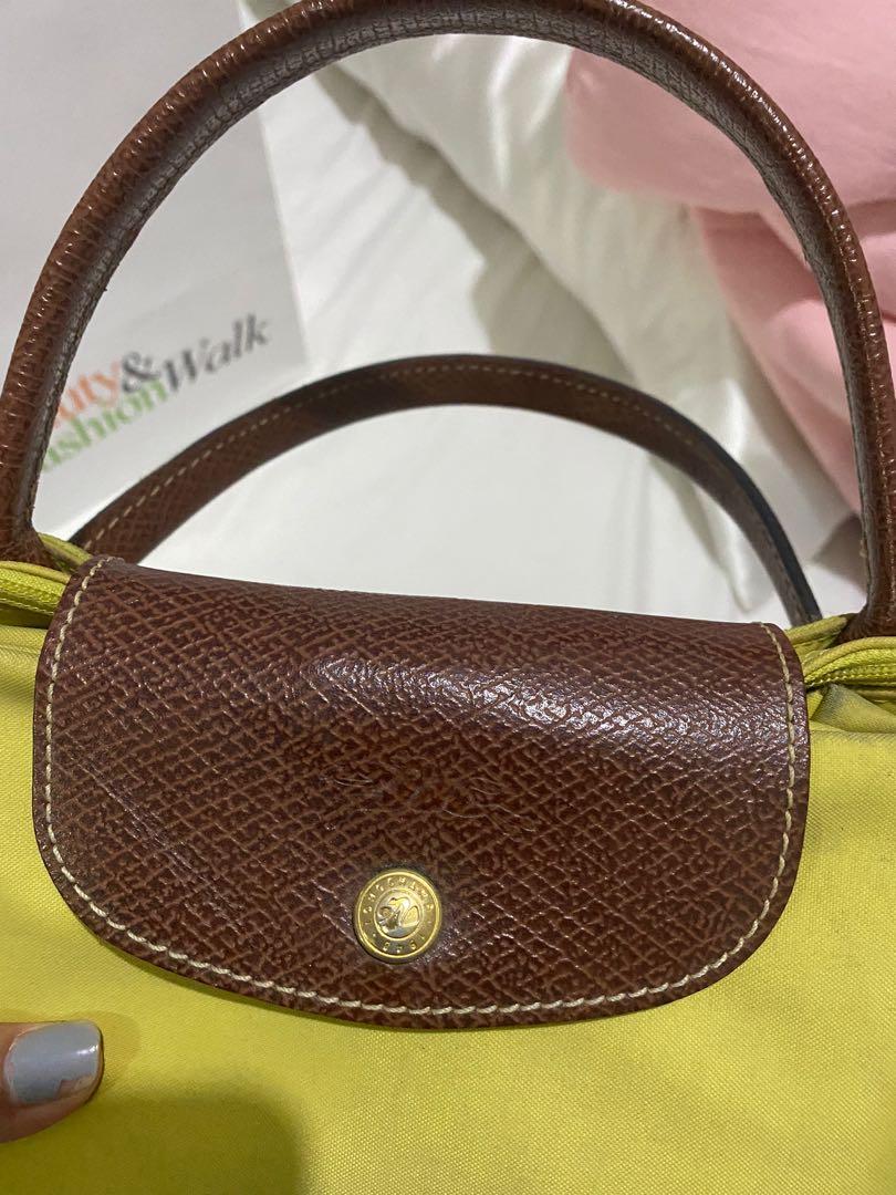 Preloved Authentic Longchamp Le Pliage (Category: Luxury Bags & Wallets) located in Cavite. Submitted by momxlittleonespreloved (Listing ID 1096825043, Image 1). Description: Preloved Authentic Longchamp Le Pliage 💯 Authentic Medium Size Short Handle Pls see attached photos for flaws In good condition See code for authenticity Php 2,000.00 ONLY!.